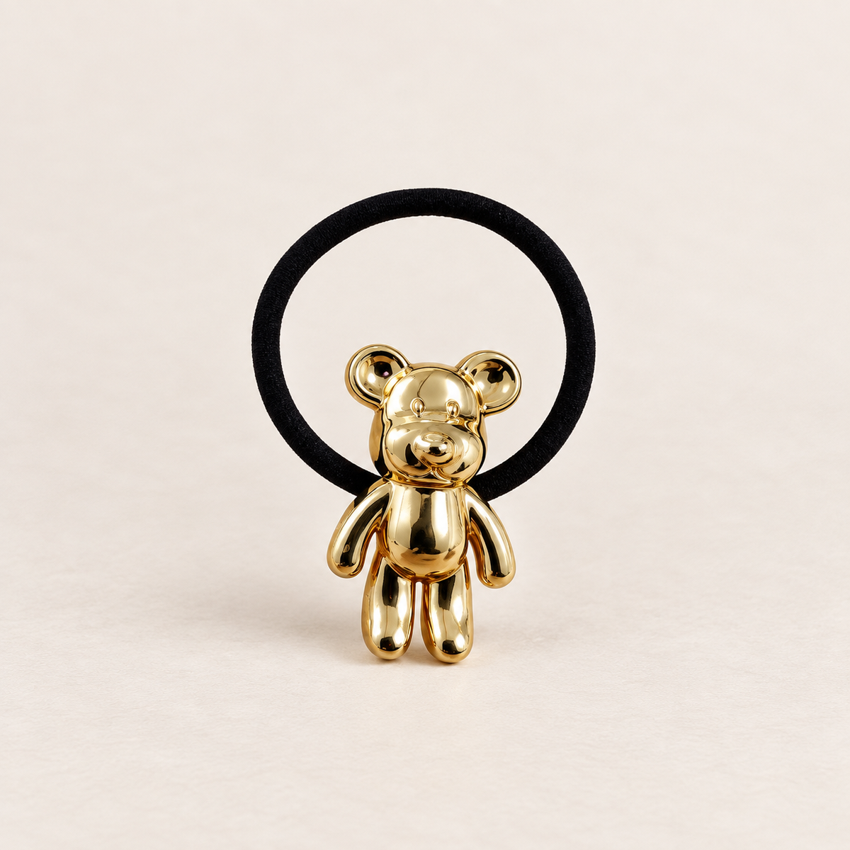 OSITO DORADO · COLETERO DE HIERRO